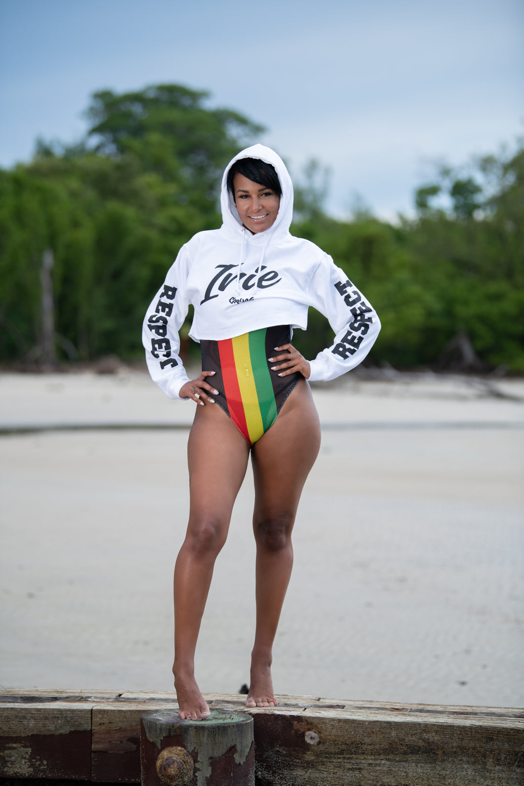 White cropped hoodie with irie graphic. Hand-printed Jamaican streetwear designs on the front, back, and sleeve for added style by Cooyah.