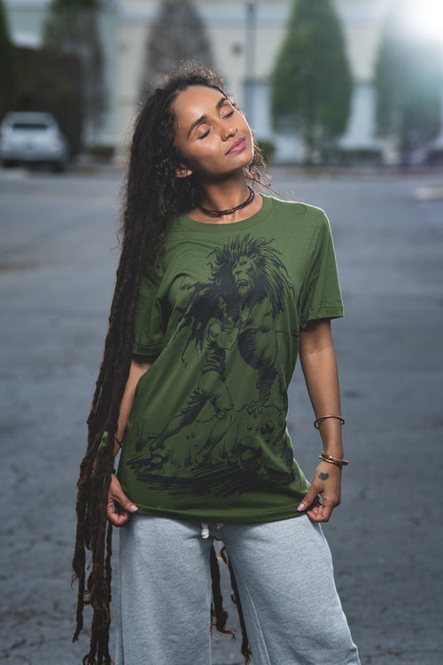 Cooyah Women's Classic Reggae Graphic Tees.  Short sleeve, olive green, soft, ringspun cotton, screen printed at Cooyah Studio.  As a Jamaican owned clothing brand since 1987, we take pride in bringing you this classic piece. Don't wait, get yours now!