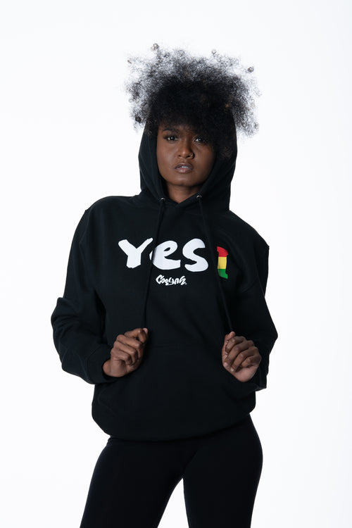 Cooyah Clothing. Women's Yes I Jamaica hoodie in black. Screen printed design in reggae colors. Jamaican streetwear clothing. IRIE