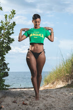 Load image into Gallery viewer, Cooyah Clothing. Made in Jamaica women&#39;s green crop top graphic tee with yellow print. Ringspun cotton, short sleeve, crew neck t-shirt. Jamaican clothing brand.

